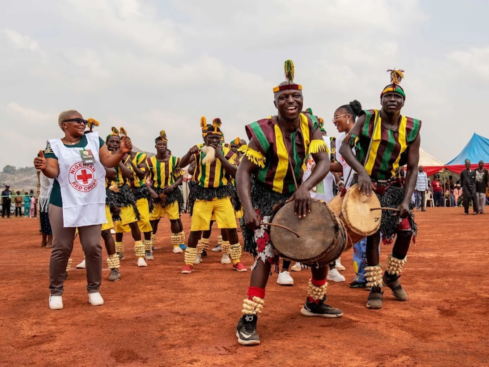 Traditional Ham drummers performing ancestral rhythms in ceremonial attire